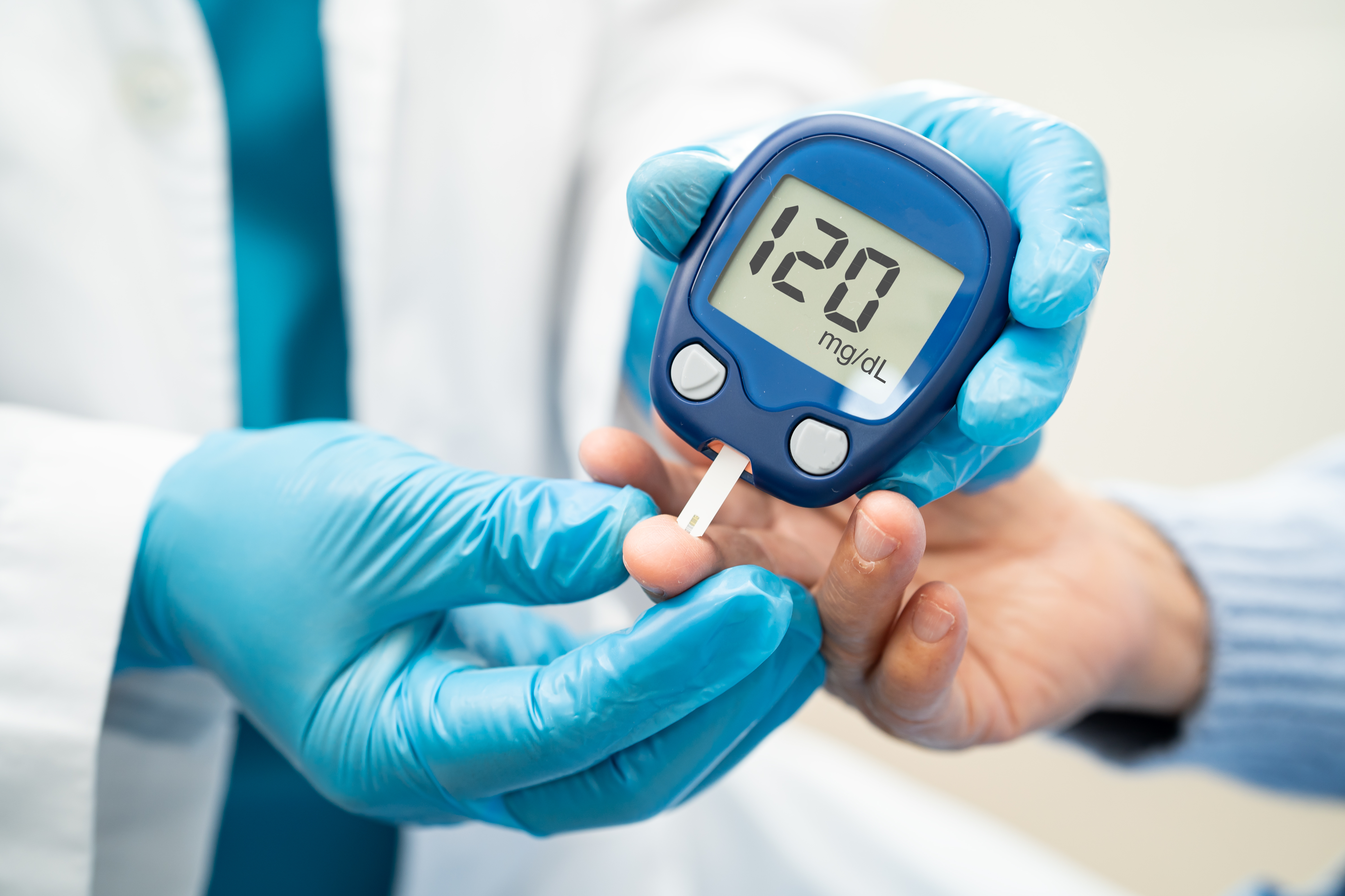 Patient using glucose monitor