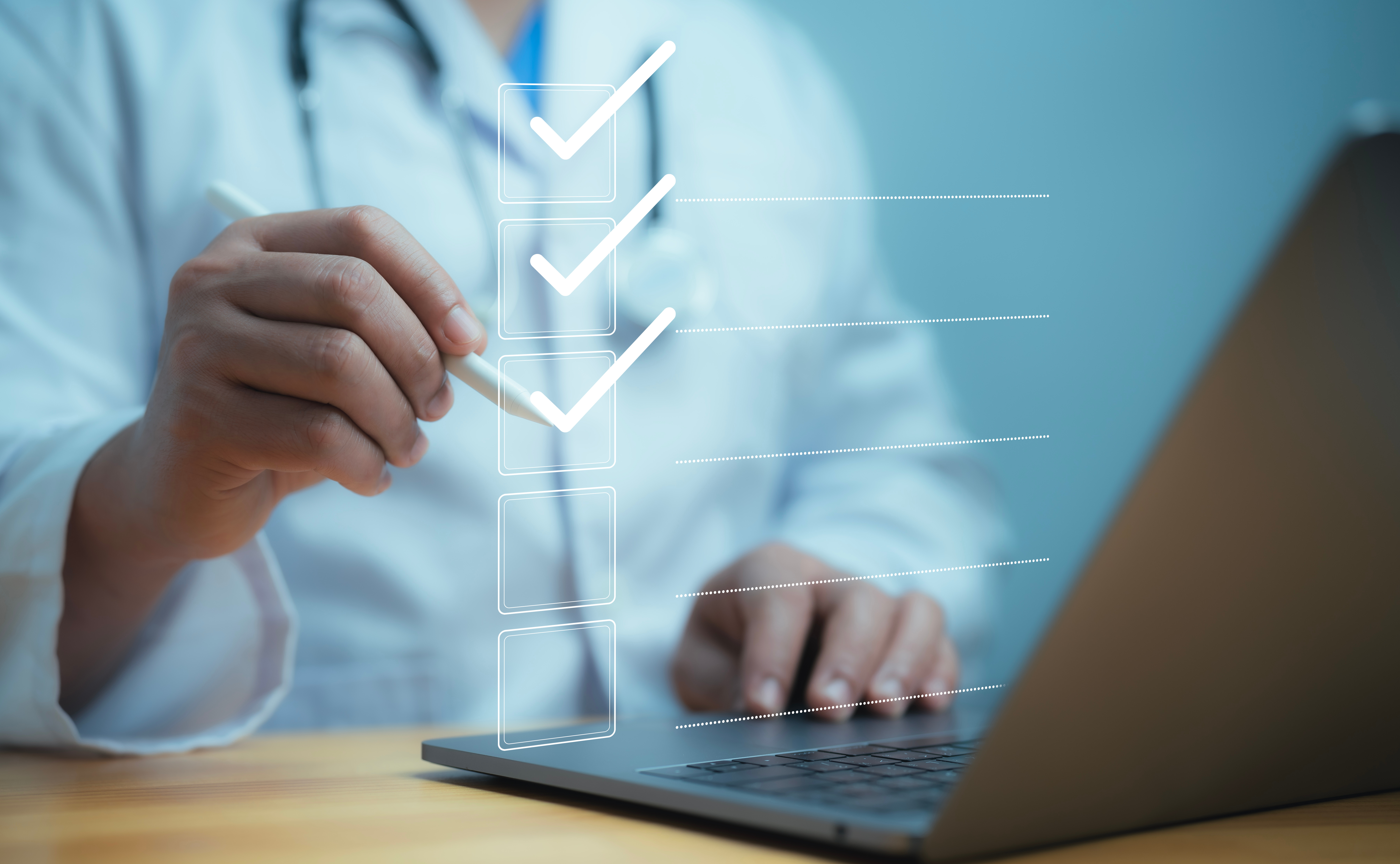 Medical worker using laptop with online checklist survey