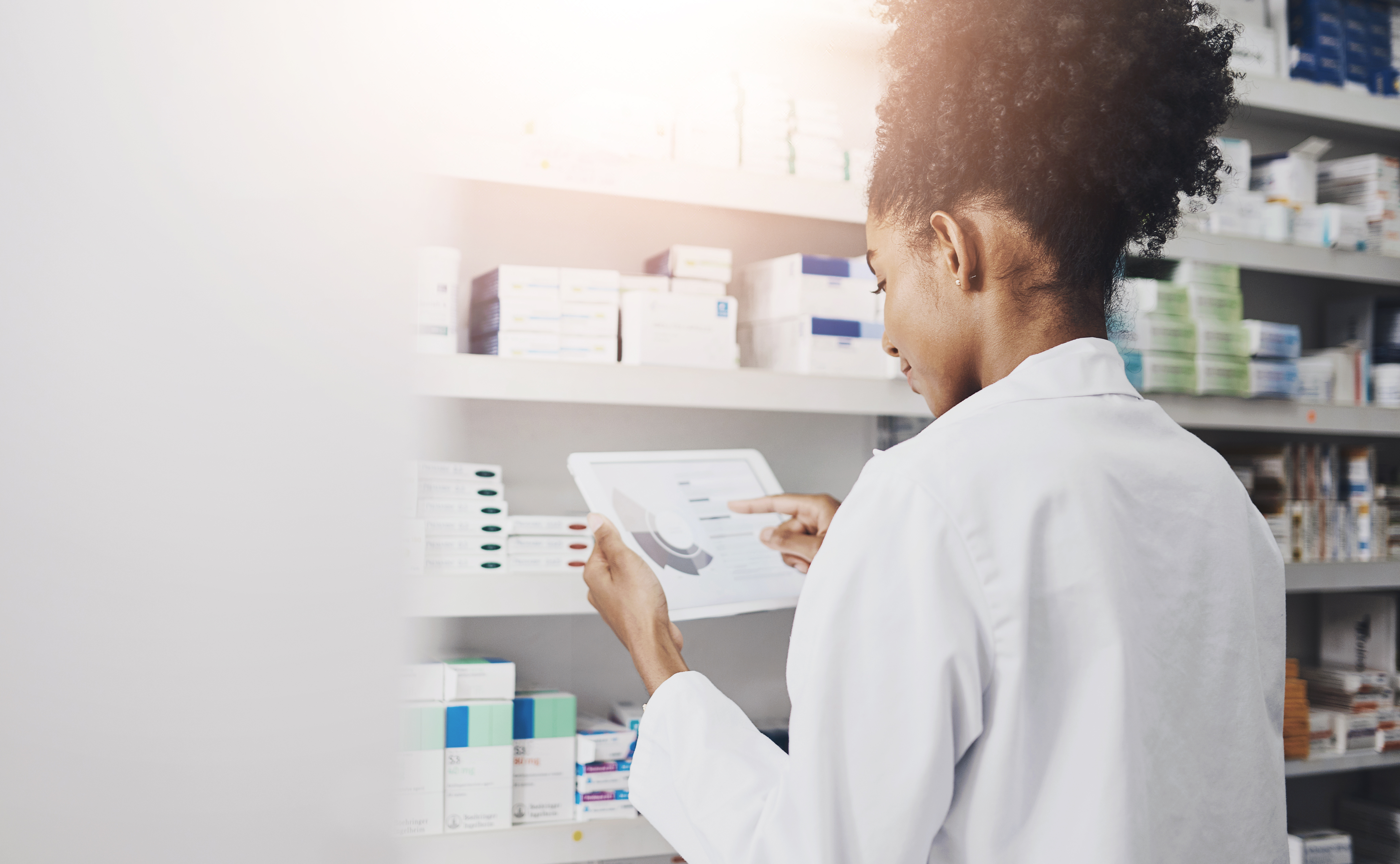 Research, stock and pharmacist on digital app for medicine, advice or benefits of pharmaceutical drugs