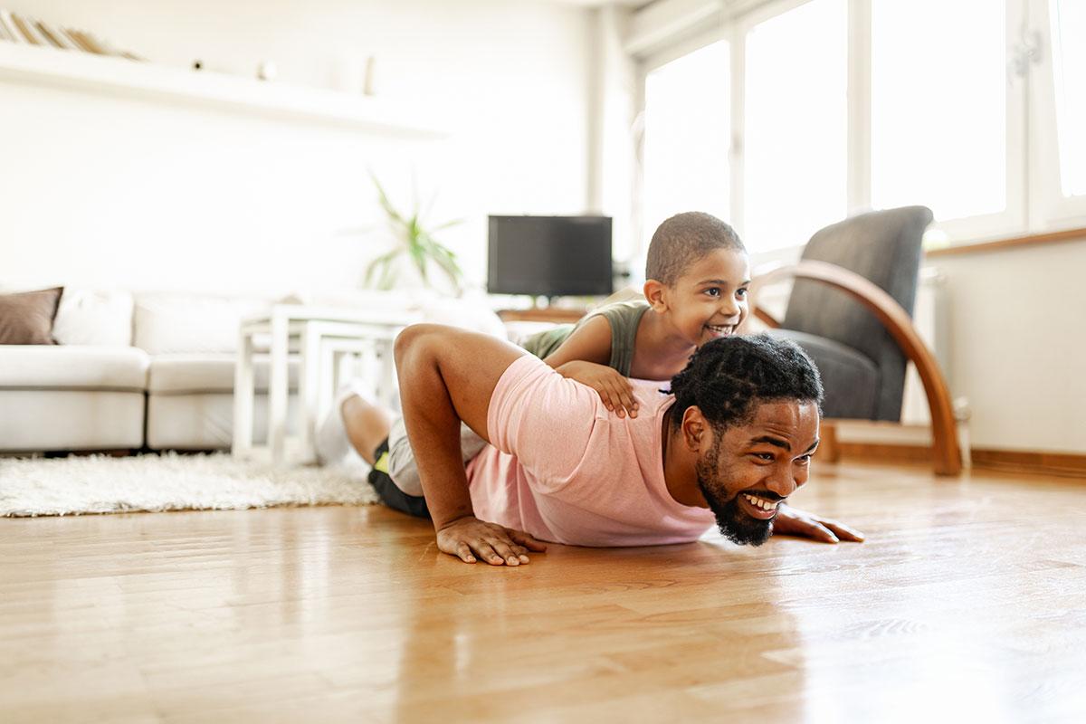 Father and child playing on the floor