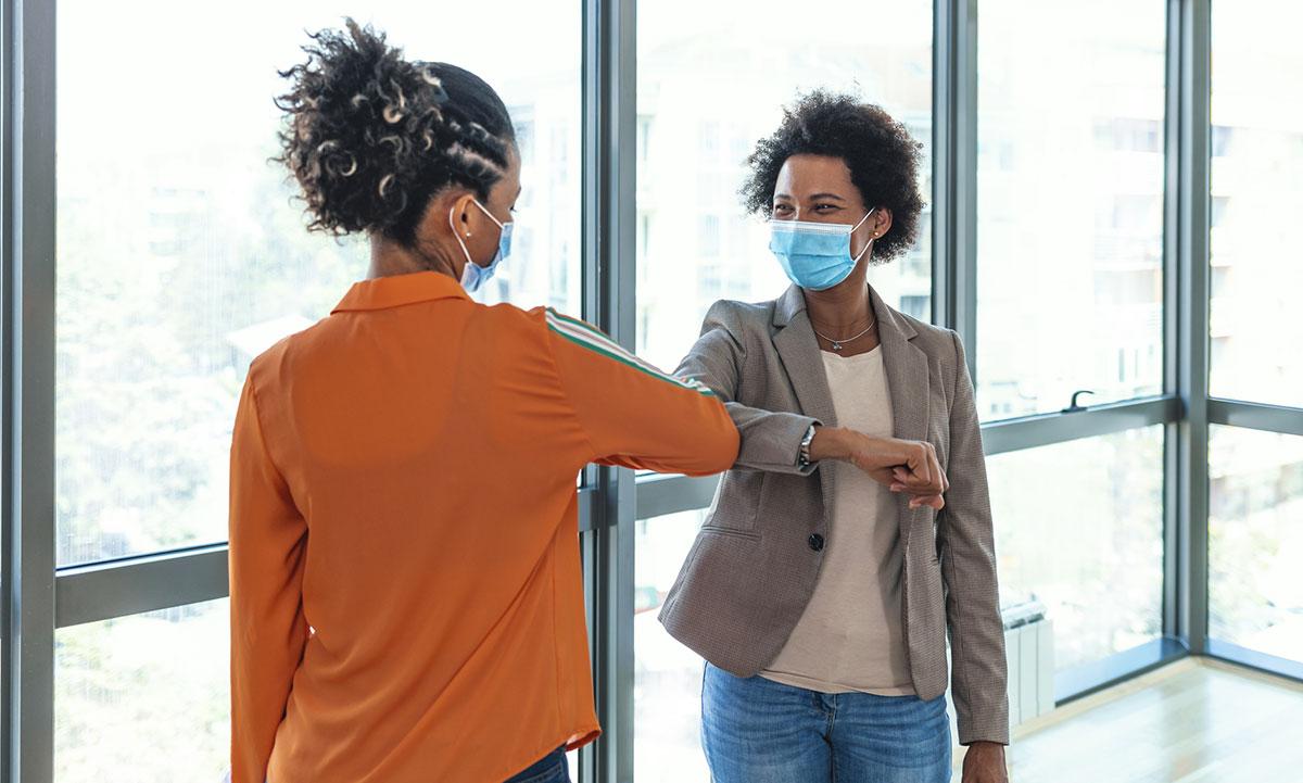 People doing elbow bump to avoid covid-19