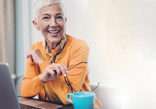 Woman with laptop and coffee