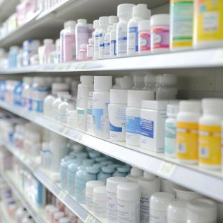 Shelf of prescription pill bottles