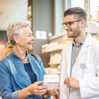 Pharmacist engaging conversation with patient