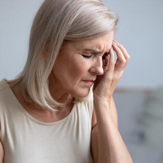 Woman suffering from headache pain