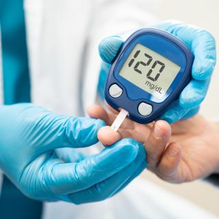 Patient using glucose monitor