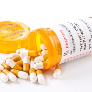 Pill capsule bottle spilled over